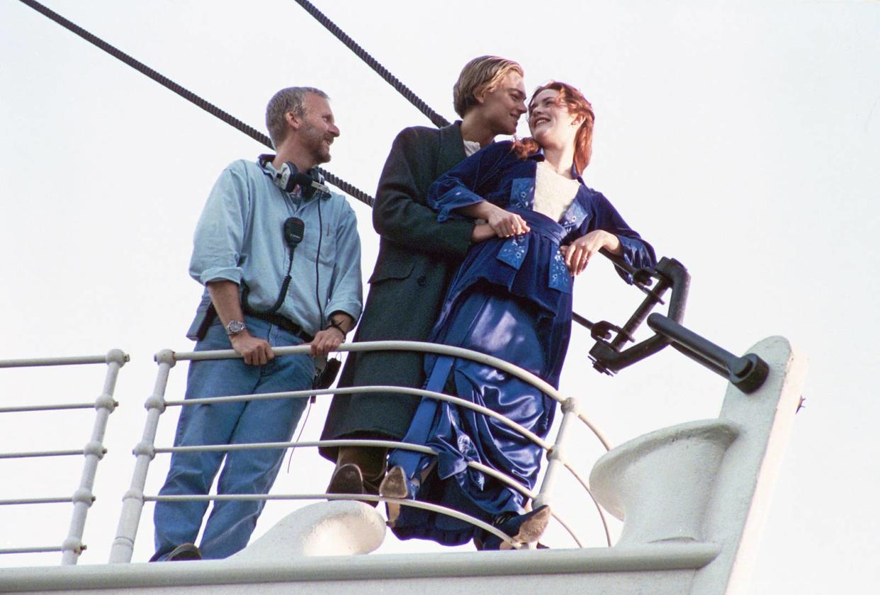 James Cameron directing Leonardo DiCaprio and Kate Winslet on the set of Titanic during the famous "I'm flying" scene