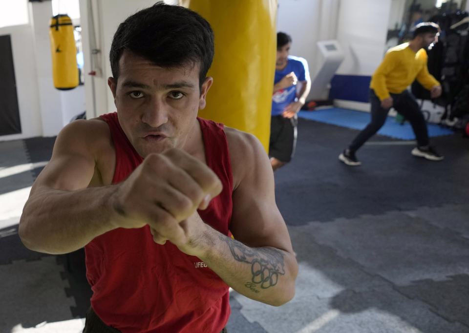 A member of the Afghan national boxing team trains during a session in local gym in Serbia, Wednesday, Dec. 1, 2021. They practiced in secrecy and sneaked out of Afghanistan to be able to compete at an international championship. Now, the Afghan boxing team are seeking refuge in the West to be able to continue both their careers and lives without danger or fear. (AP Photo/Darko Vojinovic)