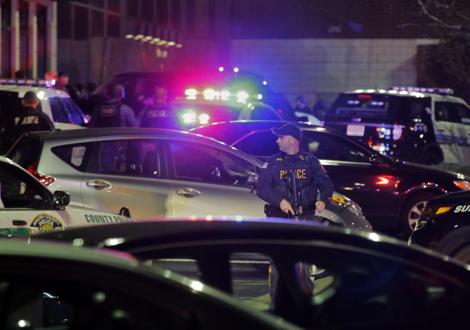 Police secure the area after reports that a gunman fired shots at the Garden State Plaza mall in Paramus, New Jersey, November 4, 2013. A person with a gun opened fire on Monday evening in the massive New Jersey shopping mall shortly before closing time, leading police to evacuate the mall and search for the shooter, but no injuries were reported, officials said. (REUTERS/Ray Stubblebine)