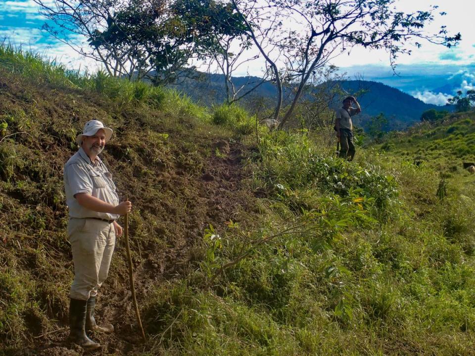 Keith Barron, the CEO and chairman of Aurania Resources, stands on a trail in southeastern Ecuador. Barron has spent more than two decades searching for two lost Spanish mines in Ecuador.