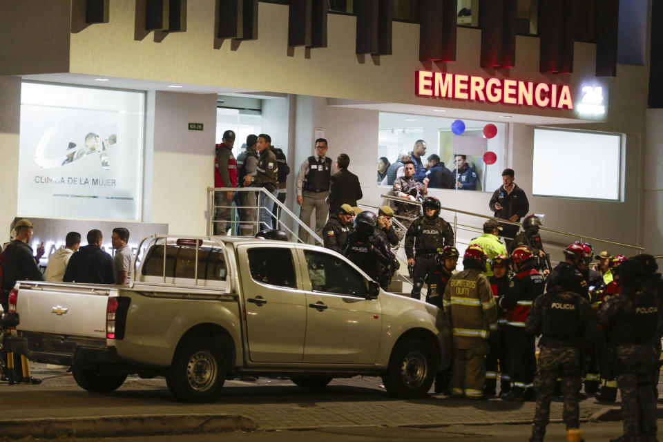 A bullet-riddled vehicle is surrounded by police as they guard the hospital where several of the injured were taken after an attack in which presidential candidate Fernando Villavicencio was shot to death in Quito, Ecuador, Aug. 9, 2023. / Credit: Juan Diego Montenegro/AP