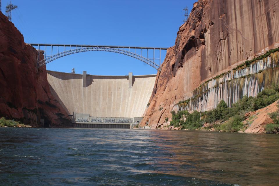 A View of Glen Canyon Dam from the Colorado River, upstream from Lees Ferry, a popular trout fishery.