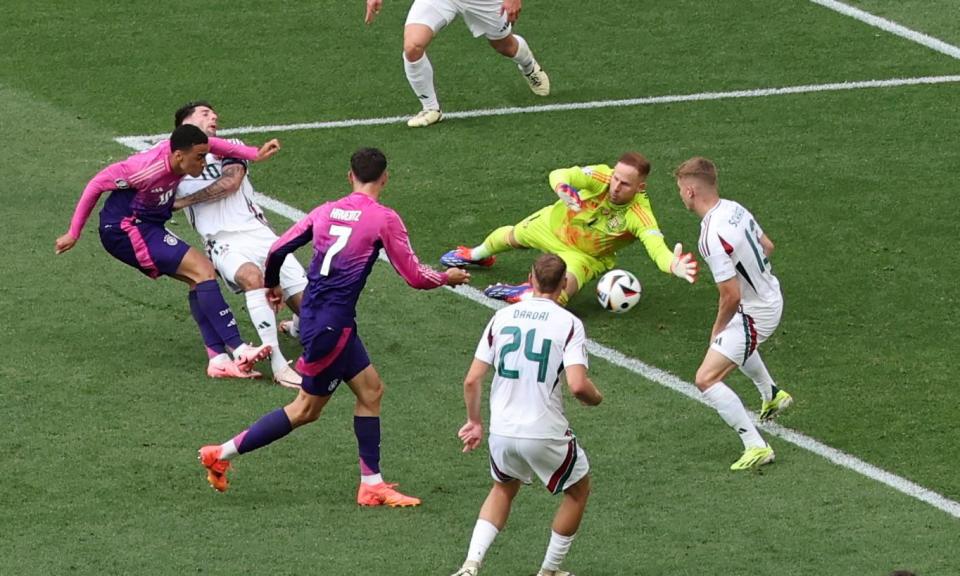 <span>Jamal Musiala scores Germany’s first but it left Hungary’s Marco Rossi furious no foul had been given.</span><span>Photograph: Mohamed Messara/EPA</span>