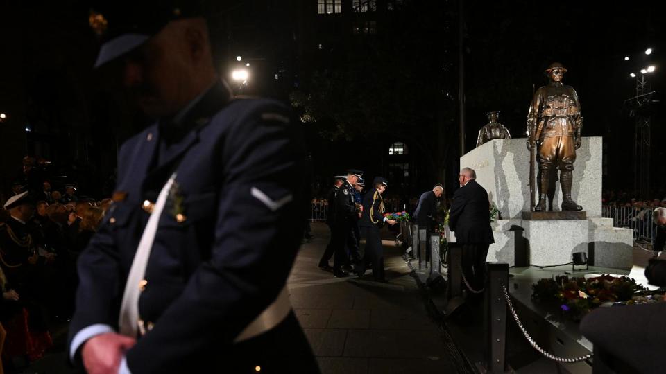 Wreaths are laid during Anzac Day Dawn Service at the Cenotaph