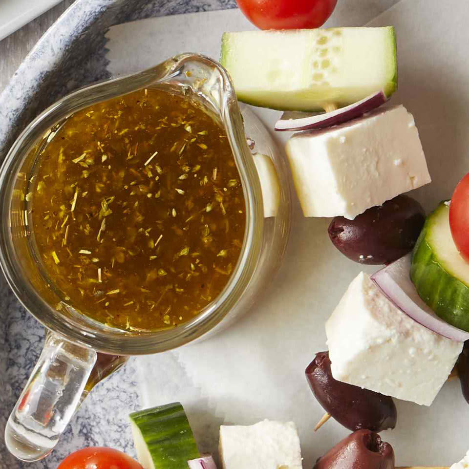 <p>This simple Greek vinaigrette is so easy to make and so finger-licking good you'll never want to go back to bottled dressing again! Drizzle it over classic Greek salad, a green salad or even use it as a marinade for grilled vegetables or chicken.</p> <p> <a href="https://www.eatingwell.com/recipe/268865/greek-salad-dressing/" rel="nofollow noopener" target="_blank" data-ylk="slk:View Recipe" class="link ">View Recipe</a></p>