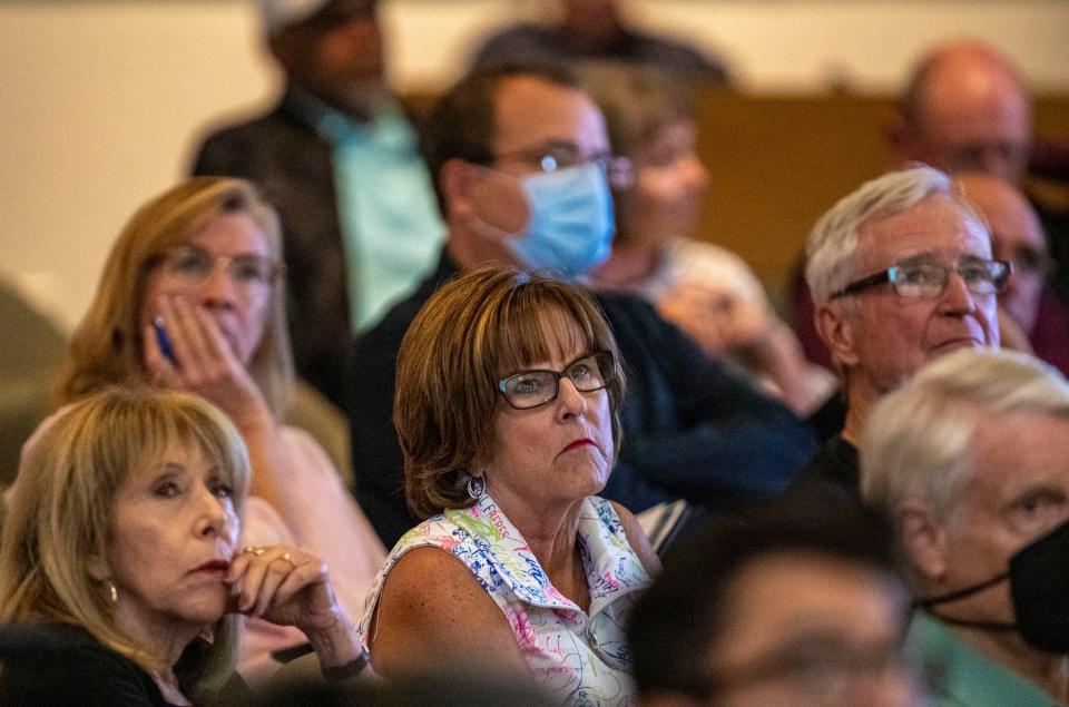 Gathered citizens and other members of the public listen to a presentation to the La Quinta Planning Commission about the Coral Mountain Resort and wave pool at La Quinta City Hall in La Quinta, Calif., Tuesday, March 22, 2022.