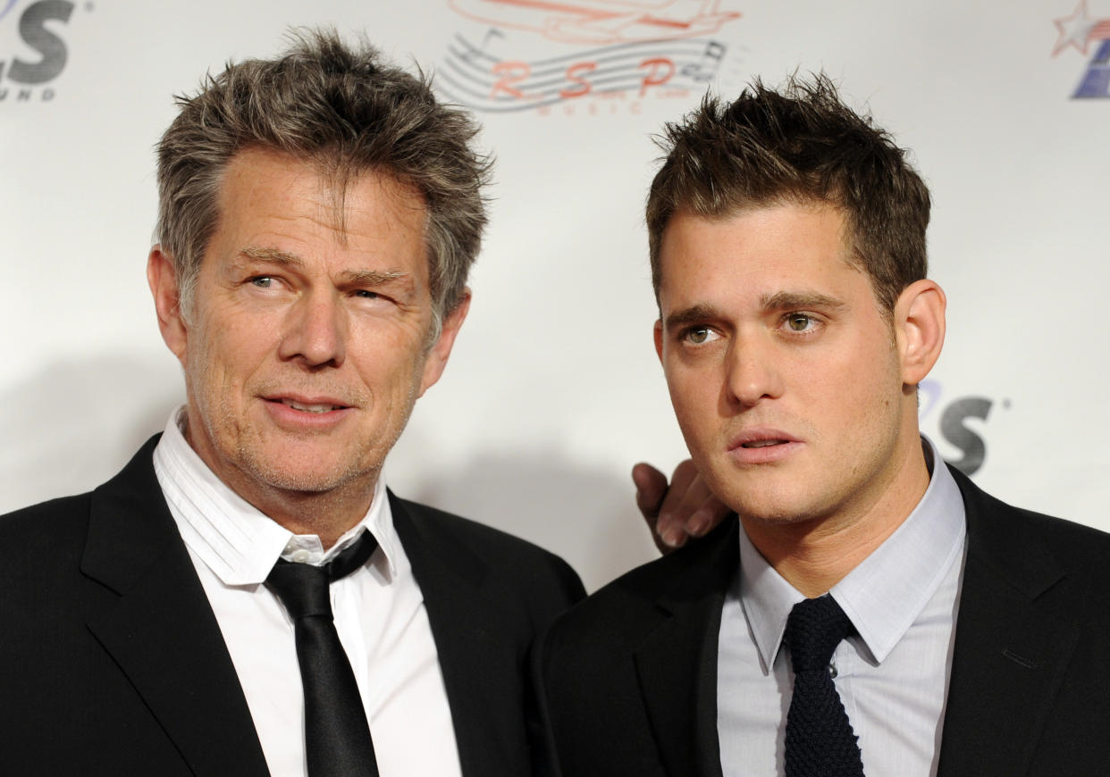 Composer David Foster and singer Michael Bubl&eacute; pose together in 2009.