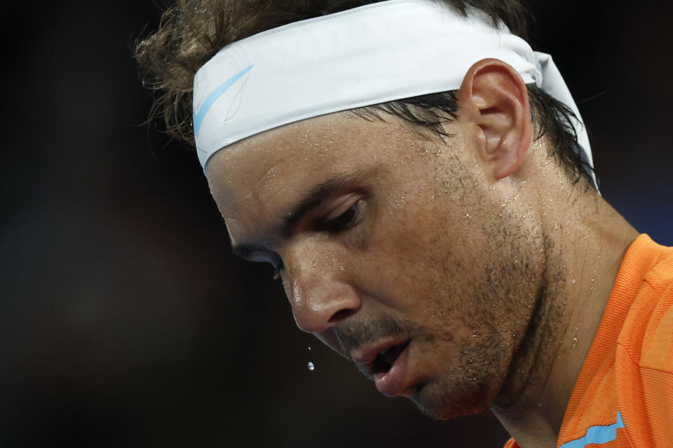 Rafael Nadal of Spain reacts during his second round game against Mackenzie McDonald of the U.S. at the Australian Open tennis championship in Melbourne, Australia, Wednesday, Jan. 18, 2023. (AP Photo/Asanka Brendon Ratnayake)