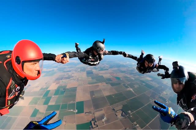 <p>Operation Solutions</p> Larry Connor and the Alpha 5 team make a five-way formation at 13000 ft during training in the skies above Davis, CA on 20 Oct 2022