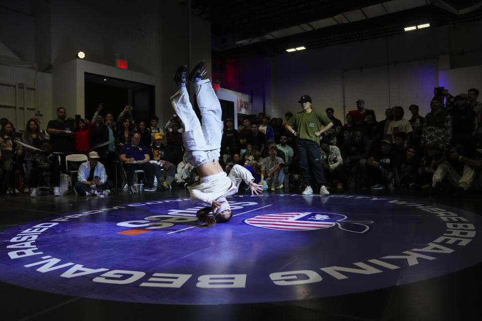 Logan Edra, left, also known as B-Girl Logistx, battles Sunny Choi, B-Girl Sunny, during the final round in the Breaking for Gold Big Apple breakdancing regional competition Saturday, April 22, 2023, in the Brooklyn borough of New York. The hip-hop dance form makes its official debut at the Paris Games in 2024. (AP Photo/Frank Franklin II)