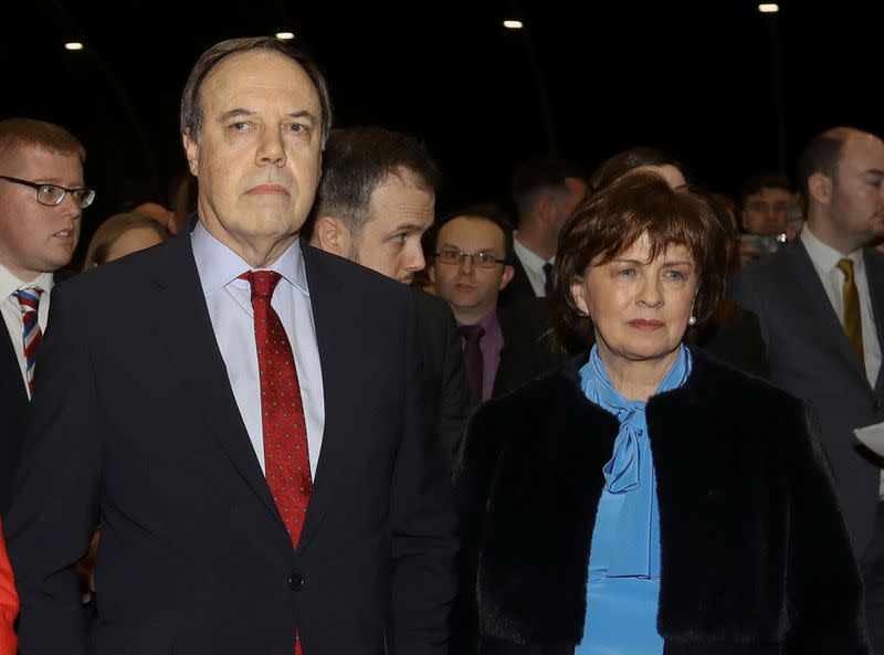 Nigel Dodds, who lost his seat to the Sinn Fein candidate, and his wife Diane listen to the speech by John Finucane, the winning candidate, at the count centre, Titanic Quarter, Belfast