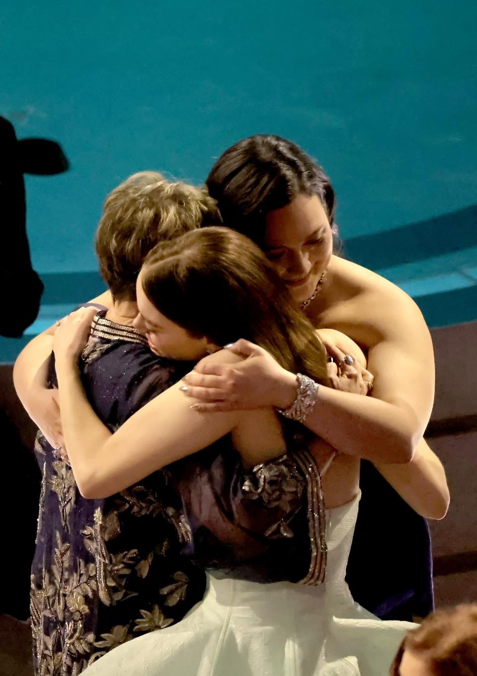 Annette Bening, Emma Stone, and Lily Gladstone embrace in the audience during the 96th Annual Academy Awards at Dolby Theatre on March 10.