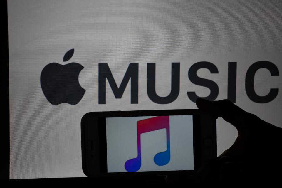 The logo of the music streaming app Apple Music is seen on a mobile screen and a laptop screen. The numbers of people using music streaming apps grow. The biggest one is the Swedish Spotify with 83 million paying users and about 100 others, that use the free version. (Photo by Alexander Pohl/NurPhoto via Getty Images)