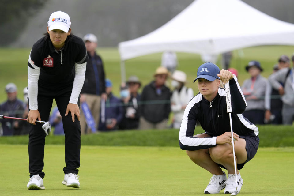 Matilda Castren, of Finland, right, and Min Lee, line up their putts on the ninth green at Lake Merced Golf Club during the final round of the LPGA Mediheal Championship golf tournament Sunday, June 13, 2021, in Daly City, Calif. (AP Photo/Tony Avelar)