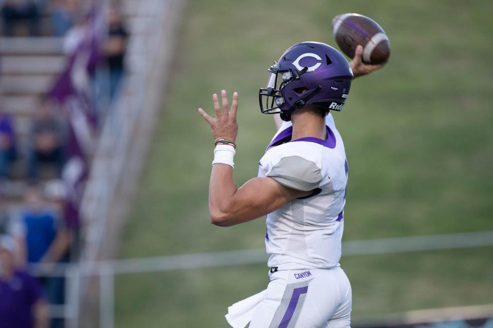 Canyon's Derrek Clements (9) attempts to throw the football during a nondistrict game Friday, Aug. 27, 2021 against Randall at Happy State Bank Stadium in Canyon.