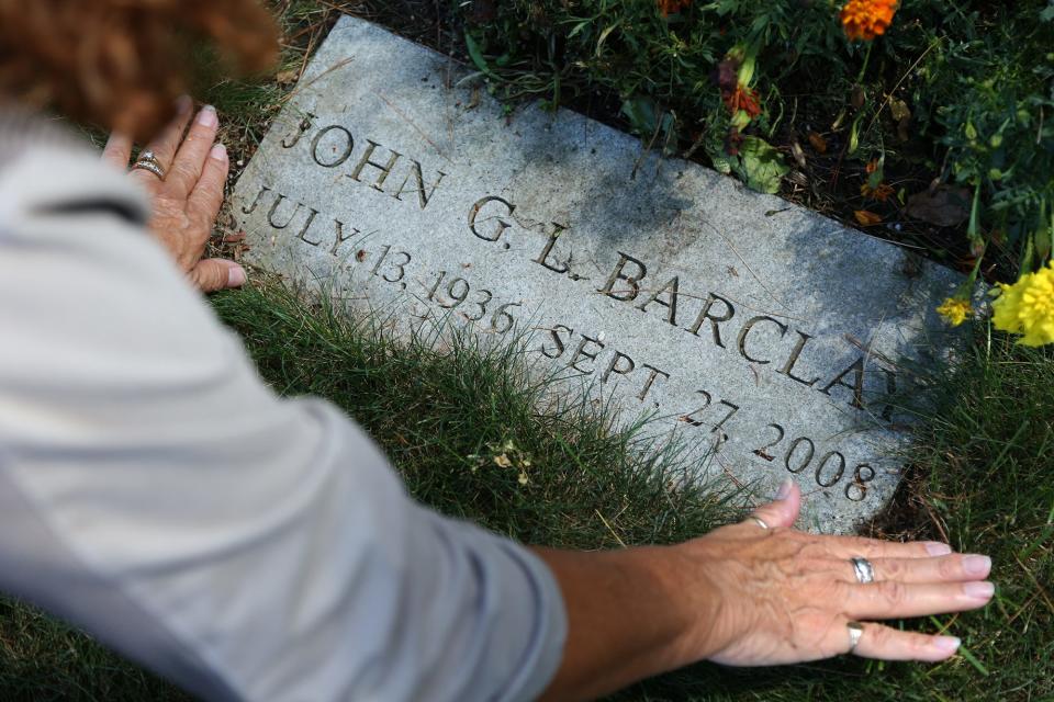 Colorado resident Marci Radin visits the grave of her biological half brother at First Parish Cemetery in York on Thursday, September 1, 2022.