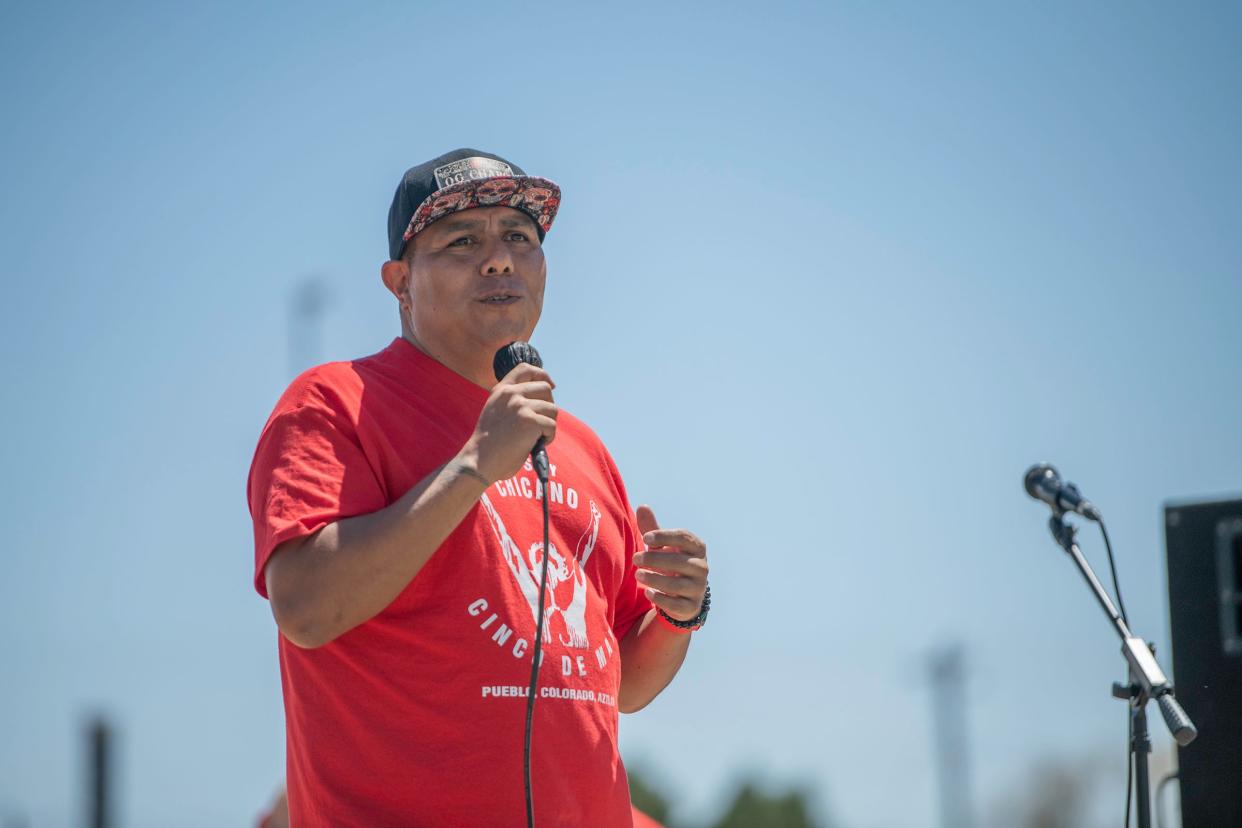 El Movimiento Sigue Executive Director José Ortega speaks to the crowd during the annual Cinco de Mayo celebration at Ray Aguilera Park on Friday, May 5, 2023.