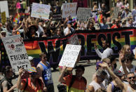 FILE - Marchers participate in the Queer Liberation March in New York, Sunday, June 30, 2019. Parades celebrating LGBTQ pride kick off in some of America's biggest cities Sunday amid new fears about the potential erosion of freedoms won through decades of activism. The annual marches in New York, San Francisco, Chicago and elsewhere take place just two days after one conservative justice on the Supreme Court signaled, in a ruling on abortion, that the court should reconsider the right to same-sex marriage recognized in 2015. (AP Photo/Seth Wenig, File)