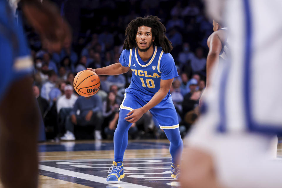 UCLA guard Tyger Campbell dribbles the ball during the first half of an NCAA college basketball game against Kentucky in the CBS Sports Classic, Saturday, Dec. 17, 2022, in New York. (AP Photo/Julia Nikhinson)