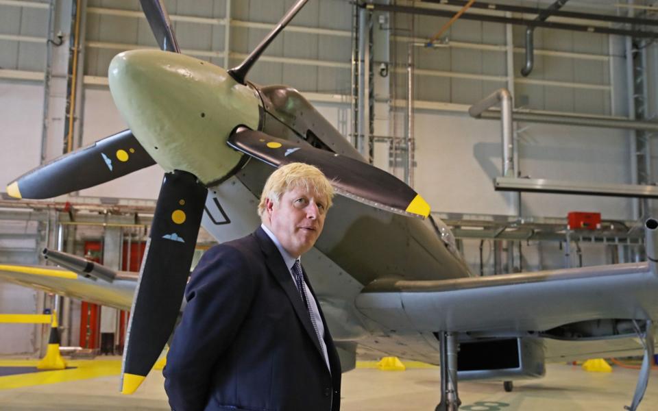 Boris Johnson visiting RAF Lossiemouth in Moray in July this year - AFP