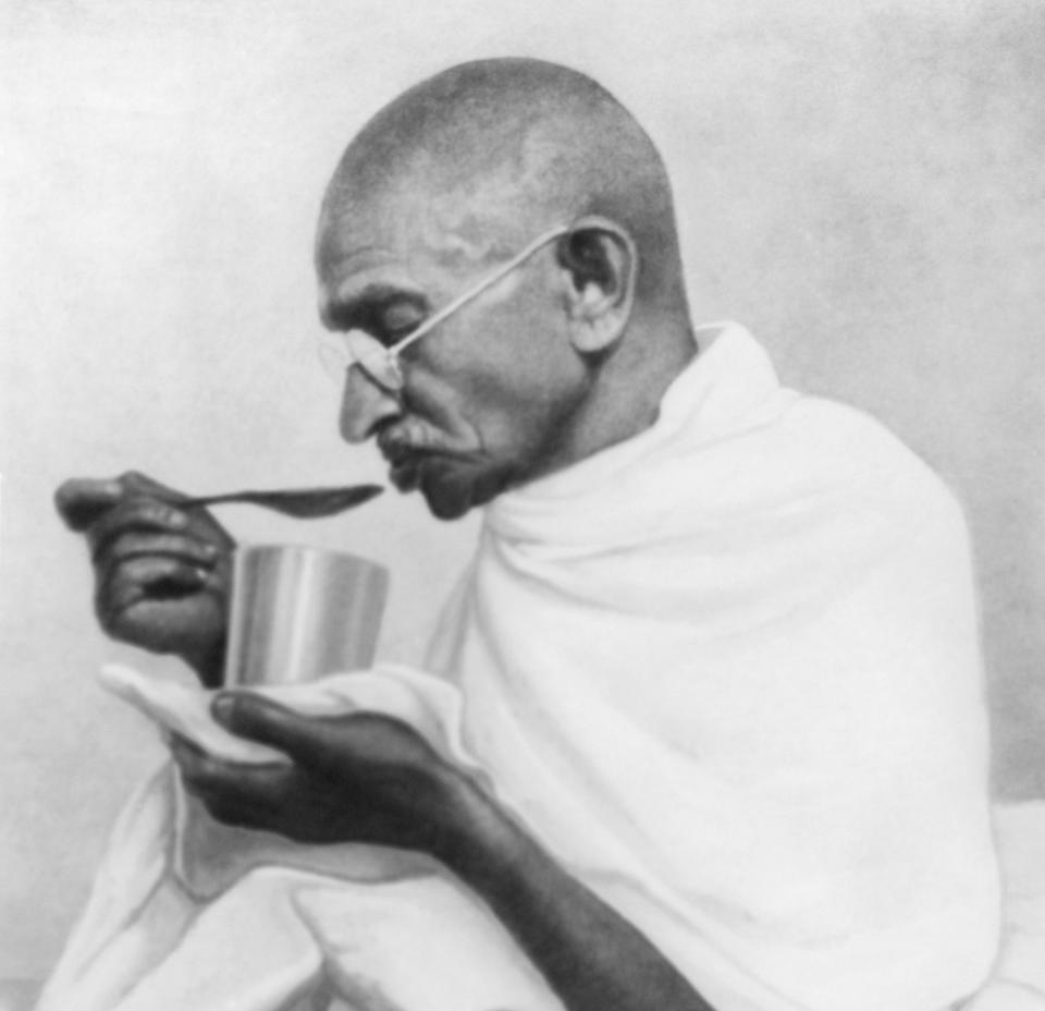 Mahatma Gandhi takes his last meal before his fast at Rashtriyashala Ashram, Rajkot, in March 1939. (Photo: Dinodia Photos via Getty Images)