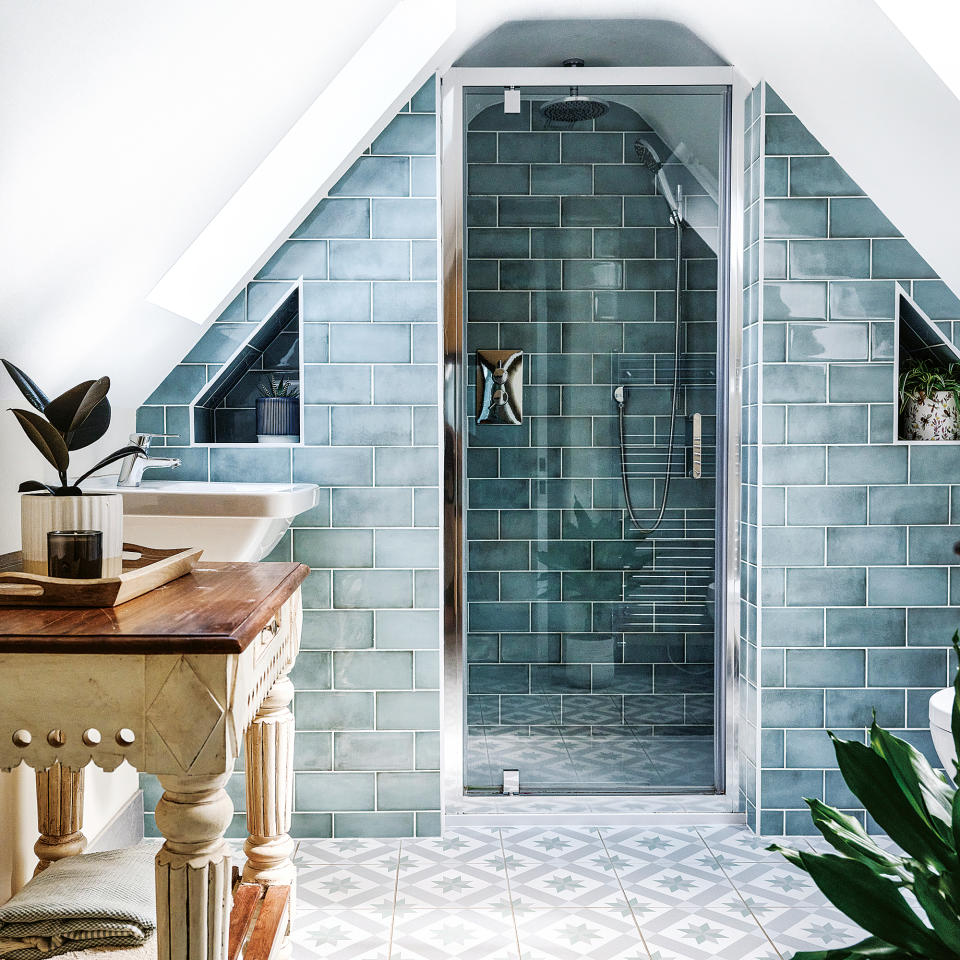 attic bathroom with blue tiled shower area