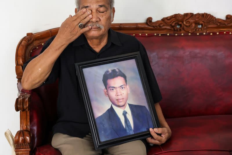 Paian Siahaan, the 77-year-old father of Ucok Munandar Siahaan reacts during an interview at his house in Depok on the outskirts of Jakarta