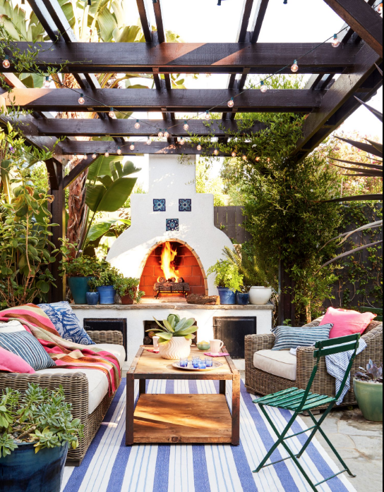 24) Keep It Cozy With an Outdoor Fireplace