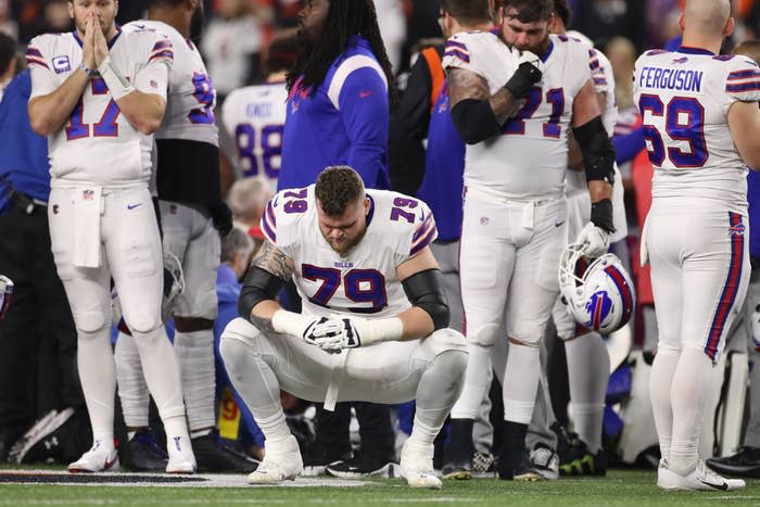 Buffalo Bills offensive tackle Spencer Brown reacts as medical personnel attend to Buffalo Bills safety Damar Hamlin on Jan. 2 in Cincinnati, Ohio.
