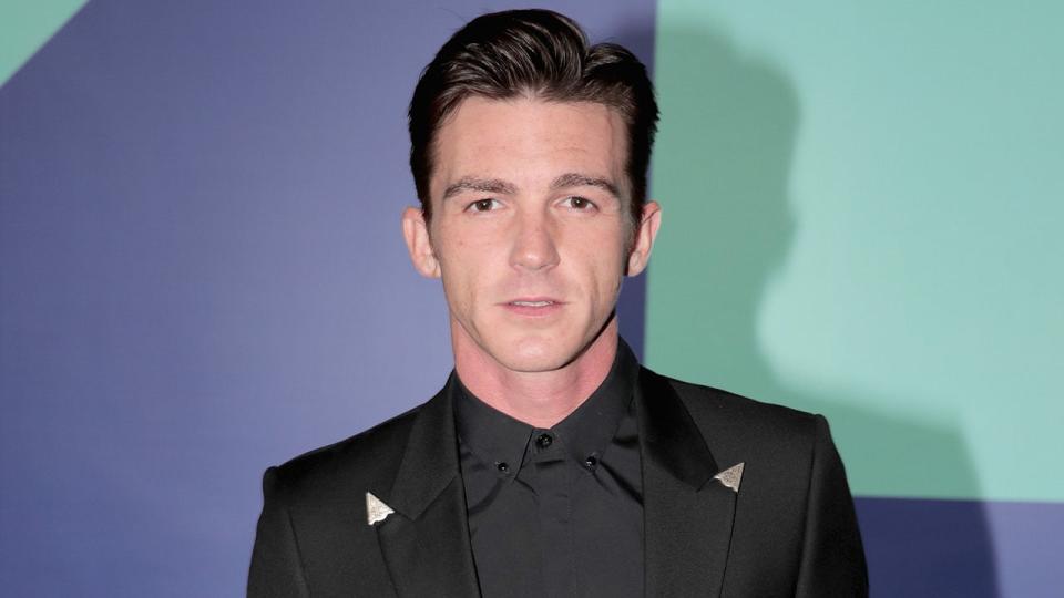 Drake Bell poses for the cameras at a red carpet event.