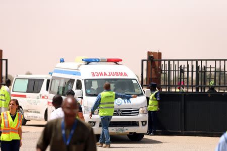 Ambulances carrying the bodies of three killed UN staff are seen leaving the tarmac at Maiduguri Airport, Nigeria March 2, 2018. REUTERS/Afolabi Sotunde