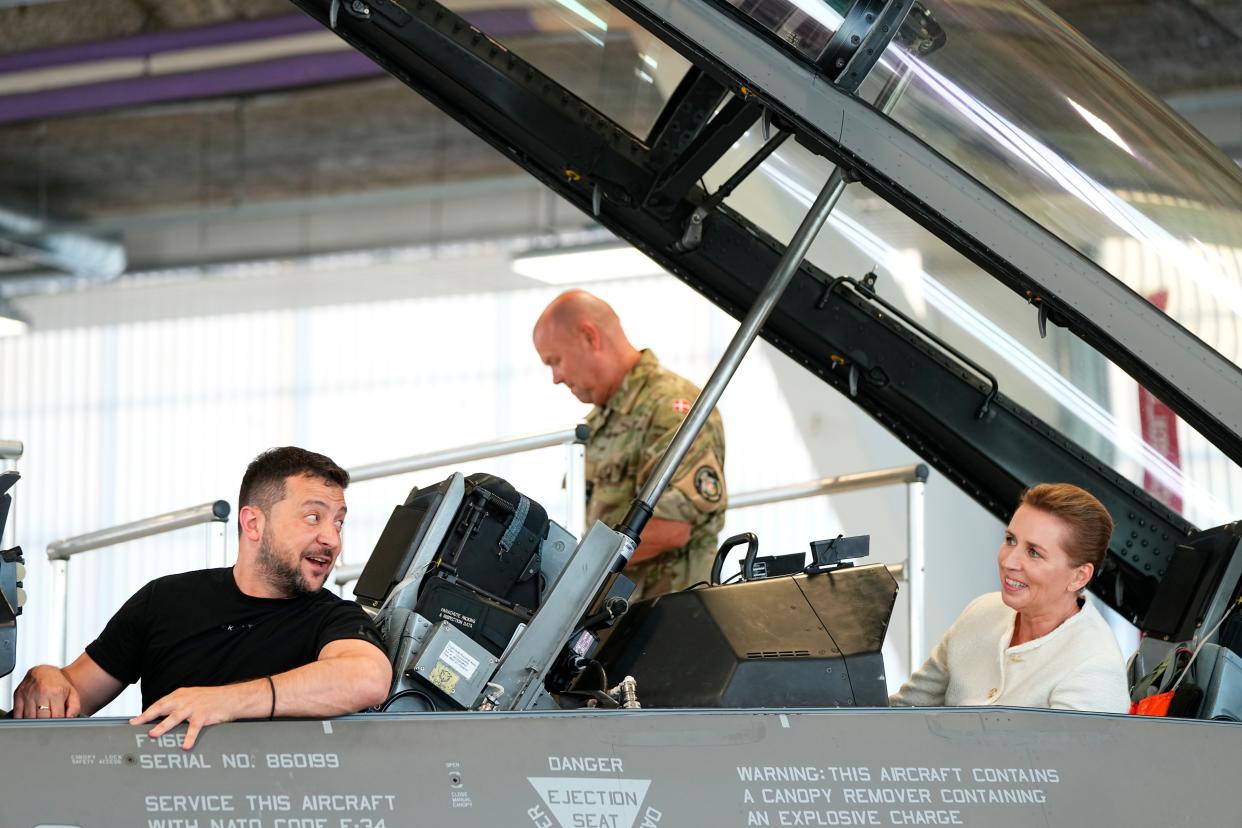 Zelensky sits in a F-16 with Mette Frederiksen (EPA)