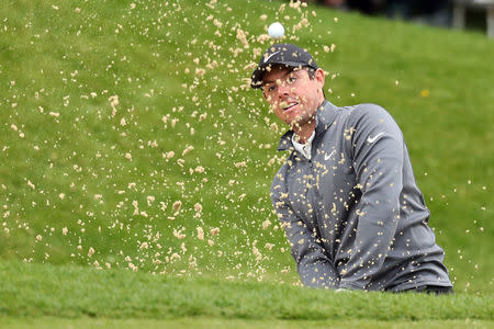 Golf - European Tour - BMW PGA Championship - Wentworth Club, Virginia Water, Britain - May 25, 2018 Northern Ireland's Rory McIlroy chips out of a bunker during the second round Action Images via Reuters/Peter Cziborra