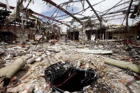 A hole is seen during a visit by human rights activists to a community hall that was struck by an airstrike during a funeral on October 8, in Sanaa, Yemen, October 16, 2016. REUTERS/Mohamed al-Sayaghi