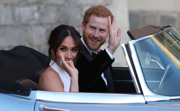 Meghan Markle and Prince Harry on their way to their royal wedding reception<p>STEVE PARSONS/AFP via Getty Images</p>