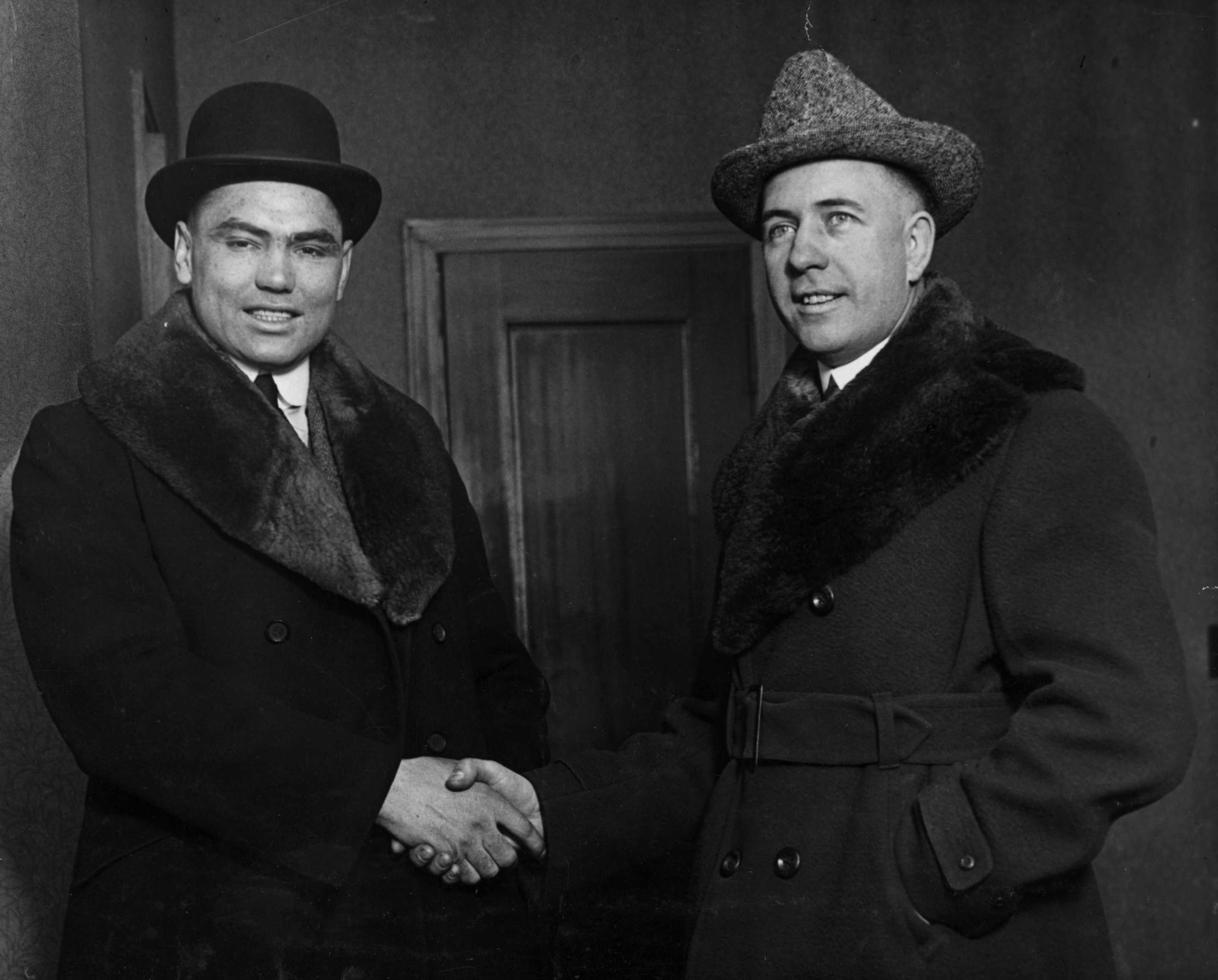 (Original Caption) 2/10/1919-New York,NY- (Left to Right)Jack Demsey, contender for Heavyweight Boxing Title and his manager Jack Kearns on their arrival in New York City to sign articles for the big fight being promoted by Tex Richard. He will sign this afternoon. (Photo by George Rinhart/Corbis via Getty Images)