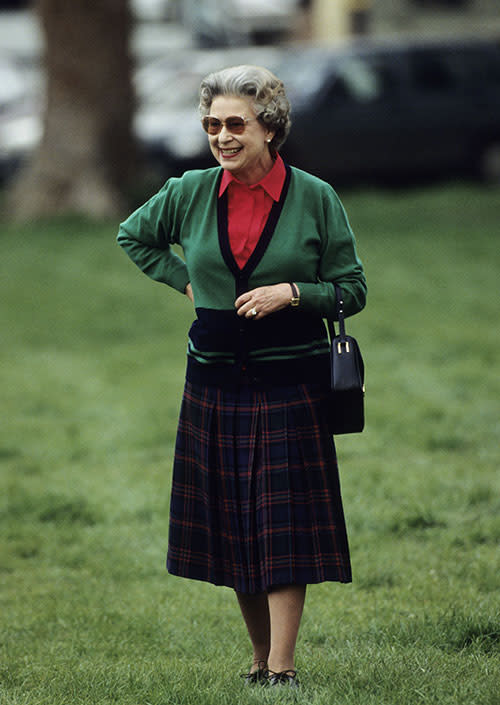 Taking part in some equestrian spectating at the Windsor Horse Show in 1991, Her Majesty paired a modest tartan skirt with a red blouse and green cardigan to create the perfect balance of countryside chic.