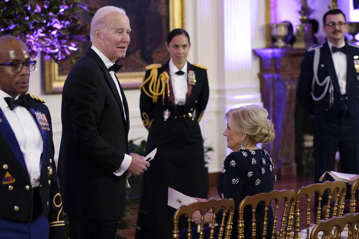 President Joe Biden and first lady Jill Biden arrive in the East Room of the White House following a dinner reception for the governors and their spouses, Saturday, Feb. 11, 2023, in Washington. (AP Photo/Manuel Balce Ceneta)