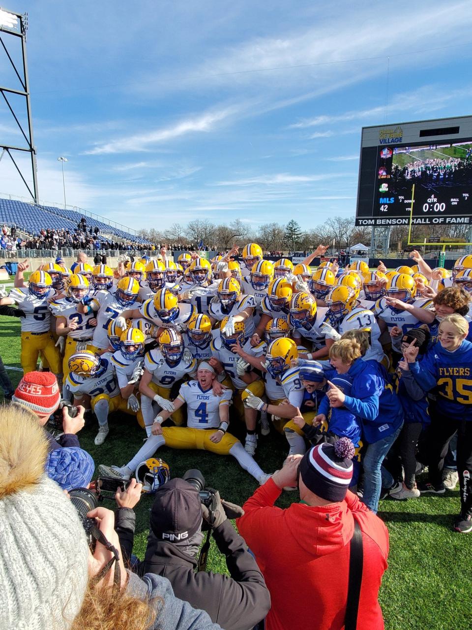 The Marion Local Flyers celebrate their state-record 12th OHSAA football state championship after beating Newark Catholic on Saturday, Dec. 4, 2021, at Tom Benson Hall of Fame Stadium.