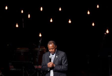 U.S. Republican presidential candidate Dr. Ben Carson leads the congregation in a prayer before speaking at the International Church of Las Vegas in Las Vegas, Nevada November 15, 2015. REUTERS/David Becker