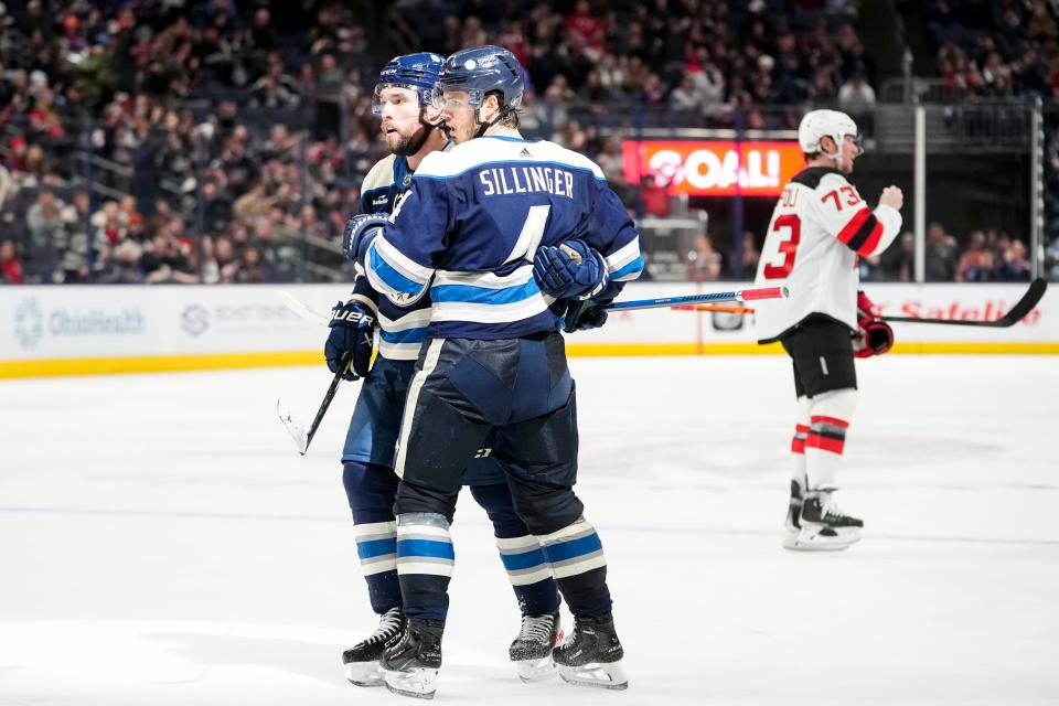 Jan 19, 2024; Columbus, Ohio, USA; Columbus Blue Jackets center Cole Sillinger (4) congratulates defenseman Ivan Provorov (9) on a goal that would later be overturned due to an offsides penalty during the third period of the NHL hockey game against the New Jersey Devils at Nationwide Arena. The Blue Jackets lost 4-1.