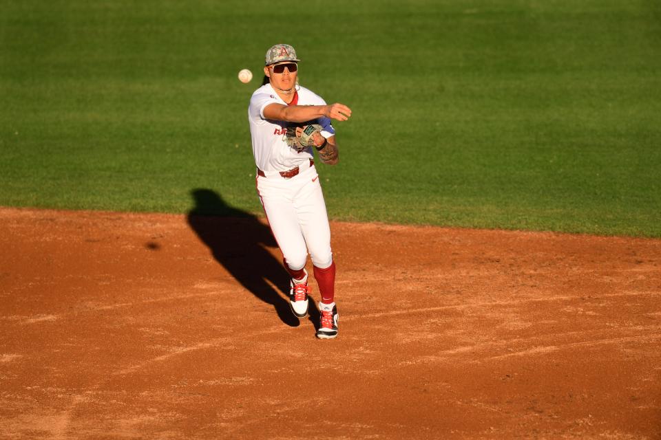 Arkansas baseball's Wehiwa Aloy fires to first during the Razorbacks' 5-2 win over Ole Miss Thursday, April 4, 2024.