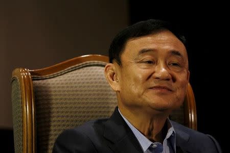 FILE PHOTO: Former Thai Prime Minister Thaksin Shinawatra looks on as he speaks to Reuters during an interview in Singapore February 23, 2016. REUTERS/Edgar Su/File Photo