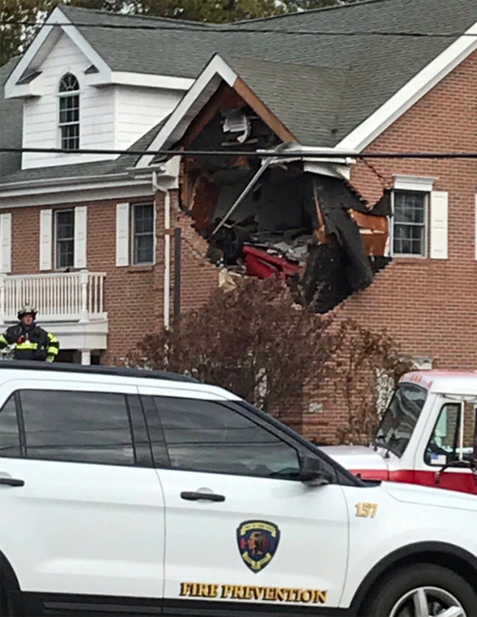 The red Porsche stuck on the second floor of the building 