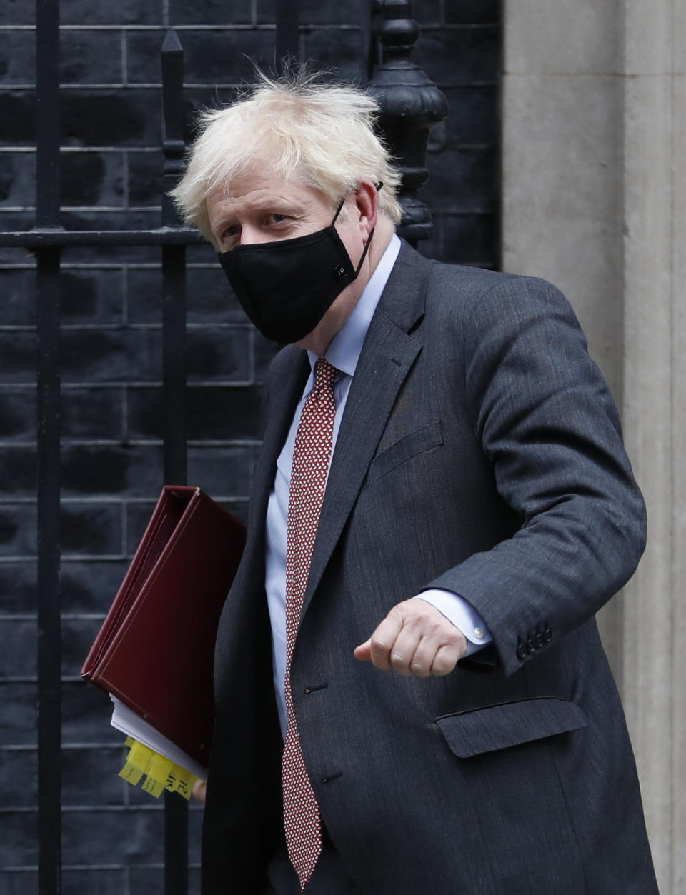 Britain's Prime Minister Boris Johnson leaves 10 Downing Street for the House of Commons to attend his weekly Prime Minister's Questions in London, Wednesday, Sept. 30, 2020. (AP Photo/Alastair Grant)