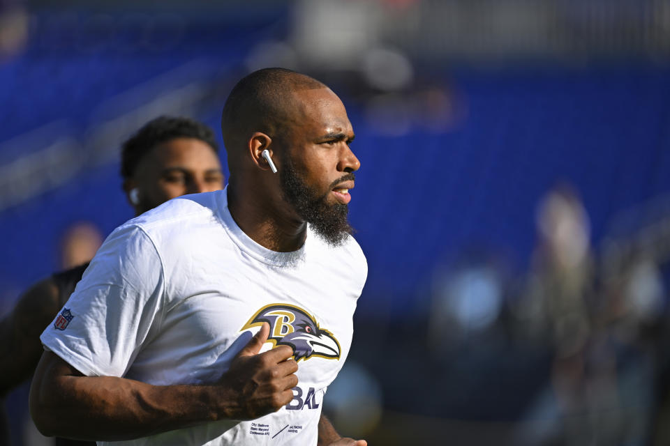 FILE -B altimore Ravens safety Chuck Clark jogs on the field during pre-game warm-ups before a NFL preseason football game against the Tennessee Titans, Thursday, Aug 11, 2022, in Baltimore. Chuck Clark's reaction was understandable after the Ravens drafted a player at his position in the first round, but after an offseason of uncertainty, the safety is still with Baltimore heading into this season. (AP Photo/Terrance Williams, File)