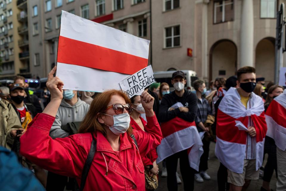 Belarusians living in Poland and Poles supporting them take part in a demonstration Monday in front of European Commission office in Warsaw demanding freedom for Belarus opposition activist Raman Pratasevich a day after a Ryanair flight from Athens to Vilnius was diverted while in Belarusian airspace.  (Photo: WOJTEK RADWANSKI/AFP via Getty Images)