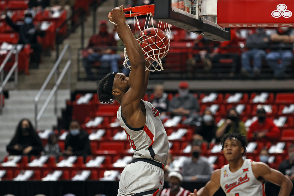 Texas Tech's Tyreek Smith (10) dunks during the first half of an NCAA college basketball game against Troy, Friday, Dec. 4, 2020, in Lubbock, Texas. (AP Photo/Brad Tollefson)