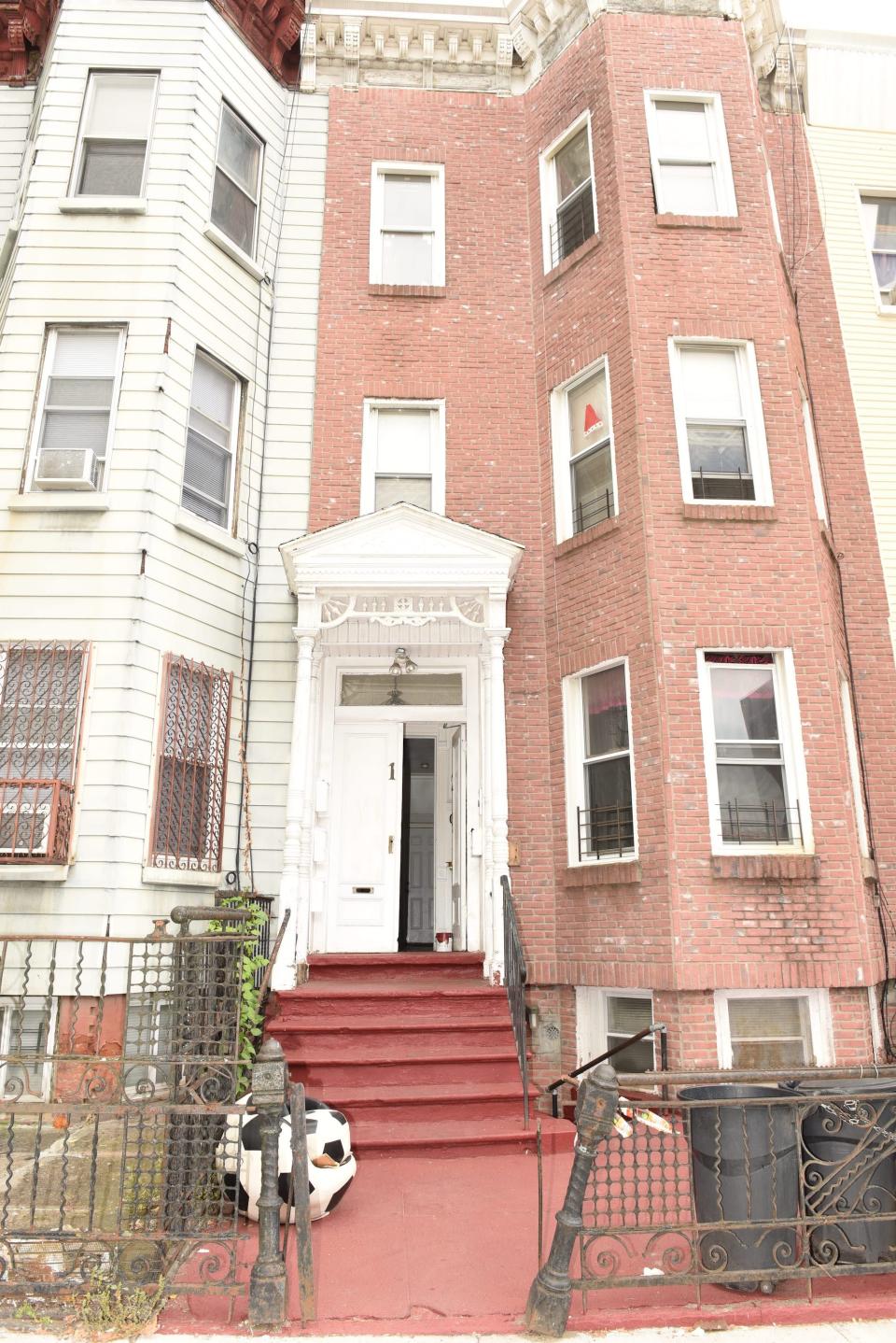 The Brooklyn row house where Quincy Pierre lived on the second floor with his mother and two younger brothers.