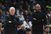 Charlotte Hornets head coach Steve Clifford, left, and Cleveland Cavaliers head coach J.B. Bickerstaff watch as their teams play during the first half of an NBA basketball game in Charlotte, N.C., Wednesday, March 27, 2024. (AP Photo/Nell Redmond)